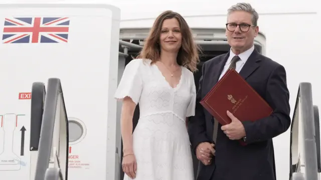 Keir Starmer boards a plane alongside wife Victoria