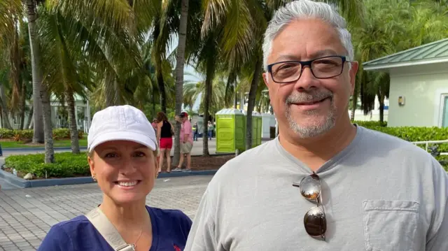 Patricia Gallardo (R) and Eduardo Gallardo (L) speak to the BBC ahead of a Trump rally in Florida