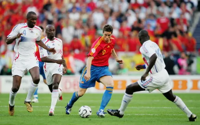 Fernando Torres of Spain tries to evade Patrick Vieira (L), Claude Makelele, and Lilian Thurham (R) of France during the FIFA World Cup Germany 2006