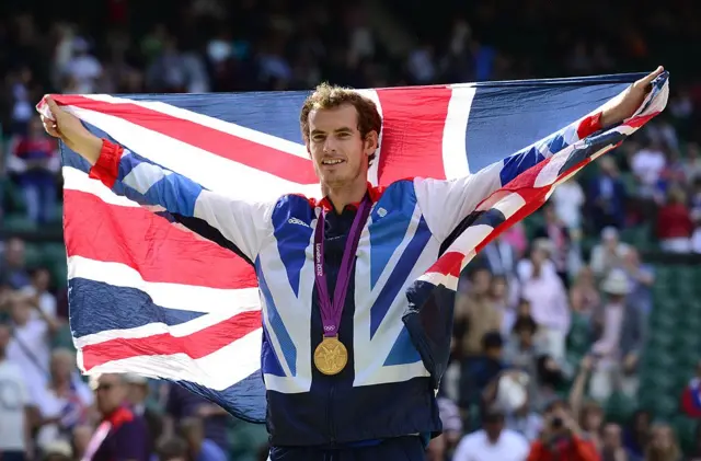 Great Britain's Andy Murray poses with his gold medal