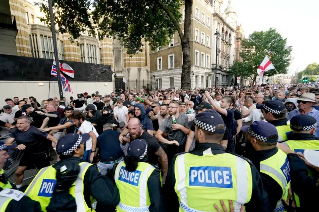 Police officers clash with protesters