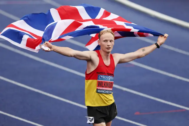 Callum Wilkinson holding a British flag