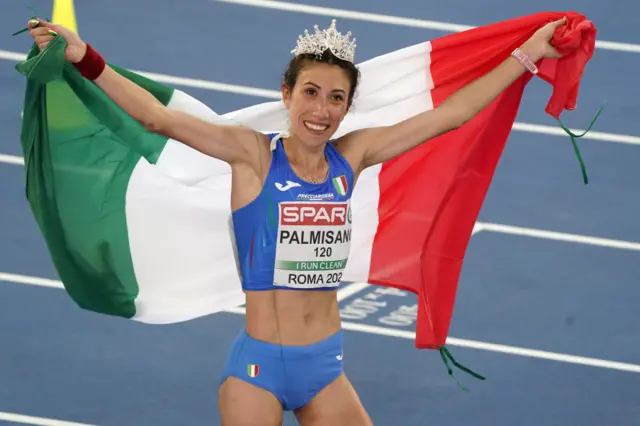 Antonella Palmisano holding an Italy flag