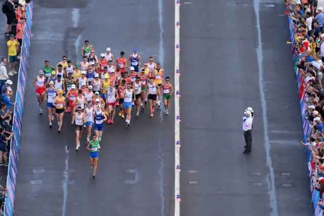 The men's 20km race walkers in action