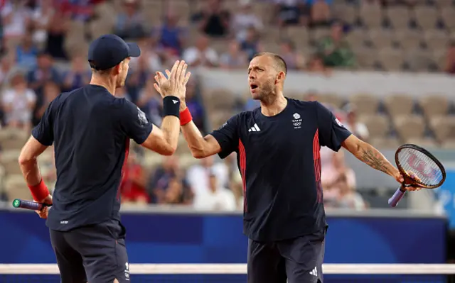 Daniel Evans of Team Great Britain celebrates with partner Andy Murray