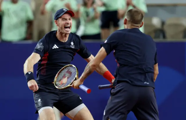 Andy Murray and Dan Evans celebrate a win