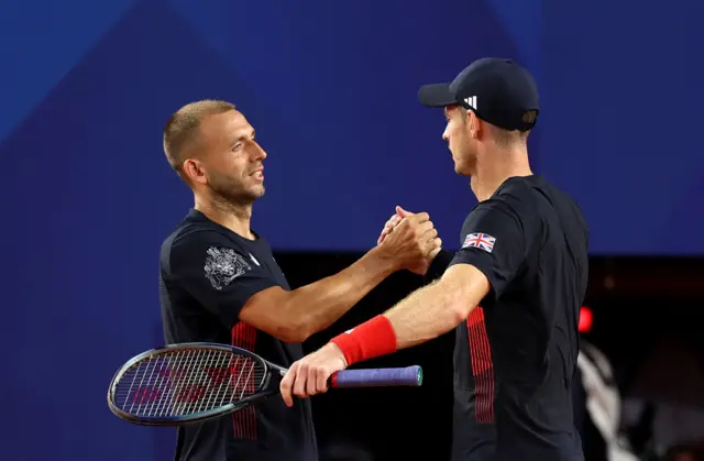 Andy Murray of Team Great Britain shakes hands with partner Daniel Evans of Team Great Britain