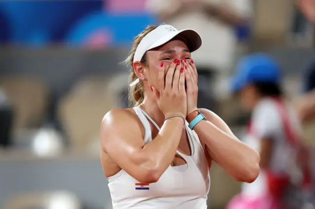 Donna Vekic of Team Croatia celebrates after winning match point against Anna Karolina Schmiedlova of Team Slovakia during the Women's Singles Semi-final match on day six of the Olympic Games Paris 2024