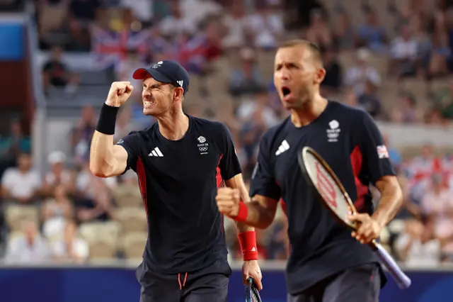 Andy Murray of Team Great Britain celebrates with partner (out of focus) Daniel Evans