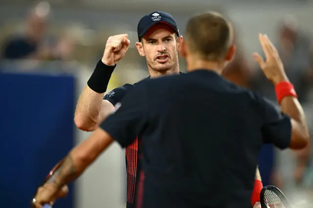 Andy Murray (L) reacts with Britain's Daniel Evans