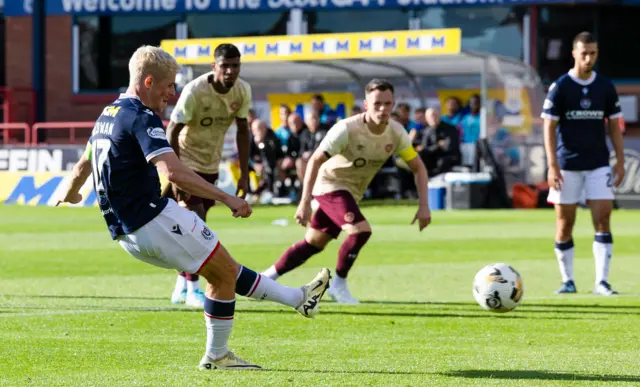 Luke McCowan scores a penalty for Dundee against Hearts