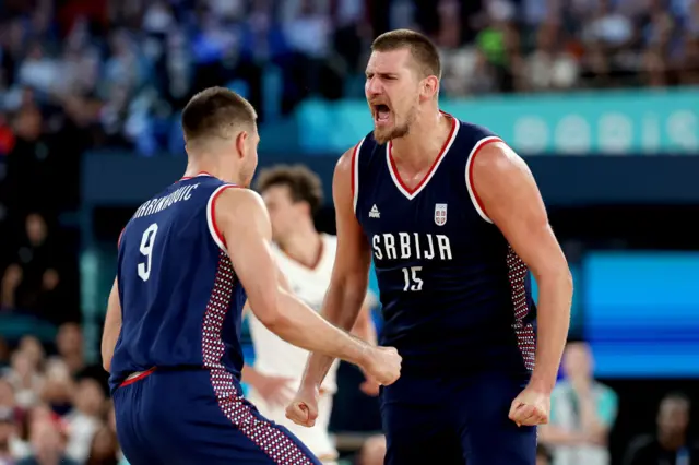 Nikola Jokic #15 of Team Serbia celebrates with teammate Vanja Marinkovic #9 after scoring during the Men's Bronze Medal Game between Team Germany and Team Serbia