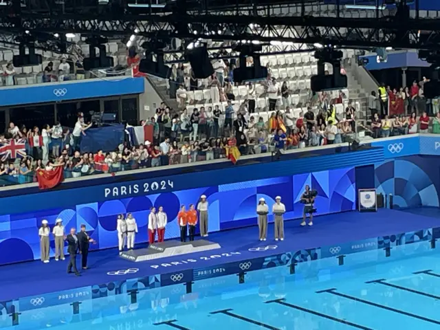 Kate Shortman and Izzy Thorpe waiting next to podium