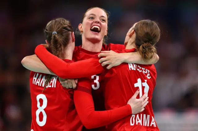 Kristina Joergensen (C), Anne Mette Hansen (L) and Line Haugsted (R) of Team Denmark celebrate winning the Bronze medal