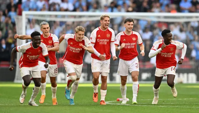 Arsenal players celebrate beating Manchester City in last year's Community Shield