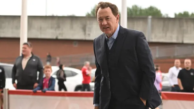 Steve Gibson arrives at the Riverside Stadium