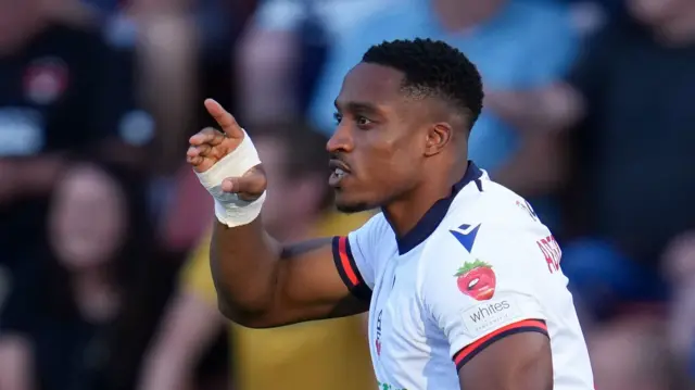 Victor Adeboyejo celebrates for Bolton