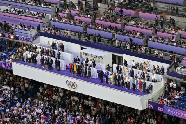 French President Emmanuel Macron, flanked by his wife Brigitte Macron (2R), President of the Paris 2024 Olympics and Paralympics Organising Committee (Cojo) Tony Estanguet (R), (front row center, from R) France's outgoing Minister for Sports and Olympics Amelie Oudea-Castera, French Prime Minister Gabriel Attal and Paris's Mayor Anne Hidalgo attending the closing ceremony of the Paris 2024 Olympic Games