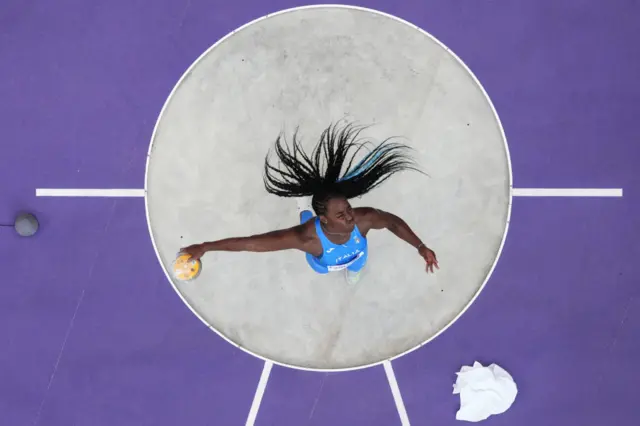 aly's Daisy Osakue practices ahead of the women's discus throw final of the athletics event at the Paris 2024 Olympic Games at Stade de France in Saint-Denis,