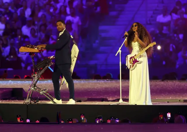 US recording artist H.E.R. performs the US national anthem