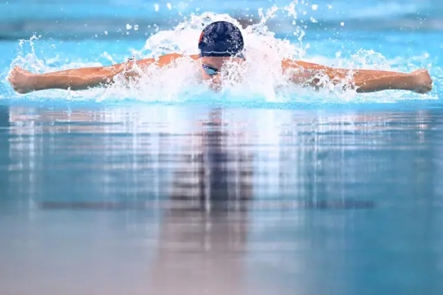 France's Leon Marchand competes in a heat of the men's 200m butterfly swimming event during the Paris 2024 Olympic Games at the Paris La Defense Arena in Nanterre