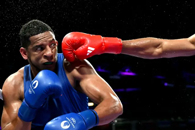 Spain's Enmanuel Reyes Pla is punched by Belgium's Victor Schelstraete in the men's 92kg quarter-final boxing match during the Paris 2024 Olympic Games at the North Paris Arena, in Villepinte