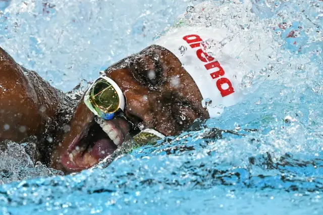 The goggles of Congo's Vanessa Bobimbo come off as she competes in a heat of the women's 50m freestyle swimming event during the Paris 2024 Olympic Games at the Paris La Defense Arena in Nanterre