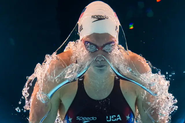 An underwater view shows US' Alex Shackell competing in a heat of the women's 200m butterfly swimming event during the Paris 2024 Olympic Games at the Paris La Defense Arena in Nanterre