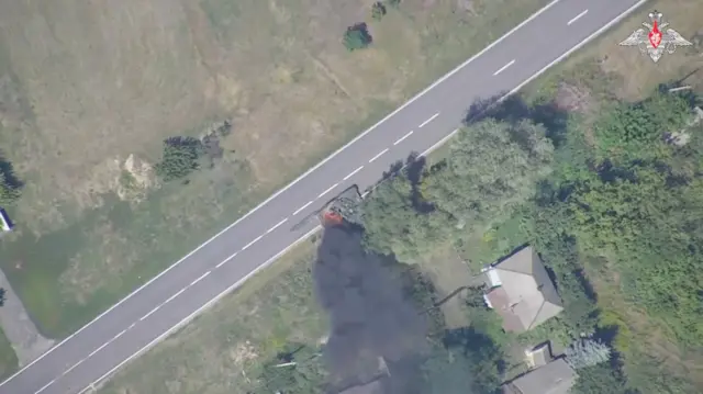 An aerial view what is said to be a burning Ukrainian tank following a Russian army strike