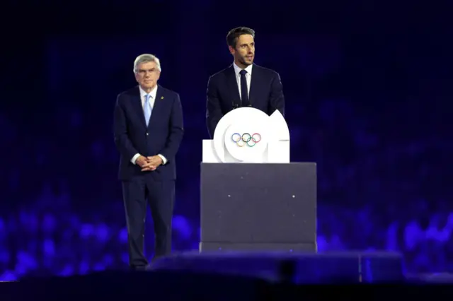 Thomas Bach, President of International Olympic Committee looks on as Tony Estanguet