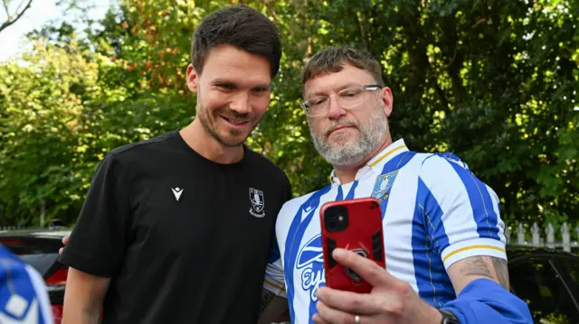 Sheffield Wednesday boss Danny Rohl and a fan