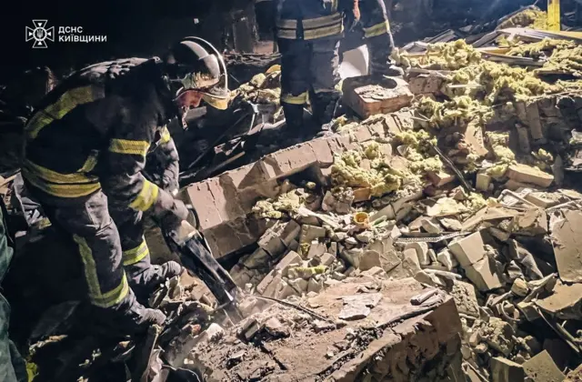 Rescuers comb through the wreckage of a house following a Russian attack in the Kyiv region. Photo: 11 August 2024