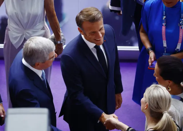 President of France Emmanuel Macron and International Olympic Committee (IOC) President Thomas Bach arrive.