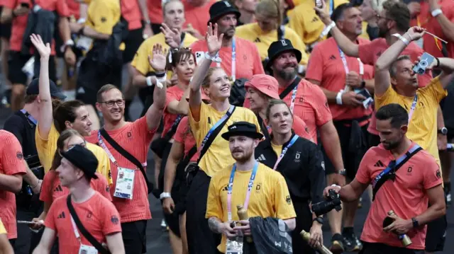 German athletes and staff enter the Stade de France