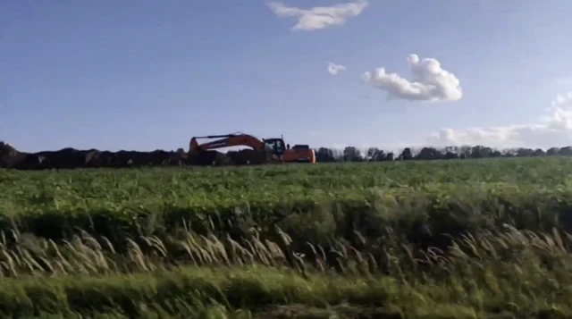 A digger helping to construct new defensive lines in Kursk