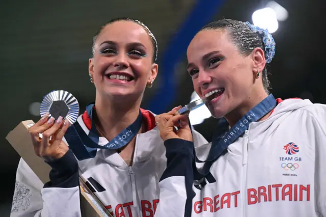 Katie Shortman and Izzy Thorpe celebrate winning silver in the artistic swimming at the Paris Olympics