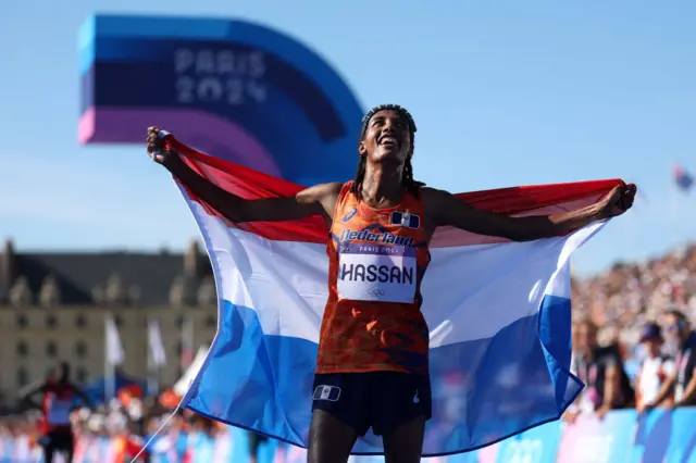 Sifan Hassan celebrates after winning gold in the women's marathon at the Paris Olympics