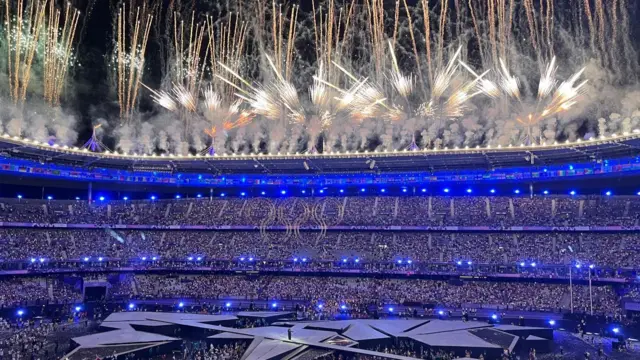 Fireworks go off over the Stade de France