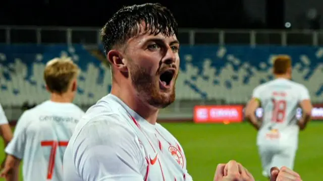 Lee Bonis celebrates Larne's victory over Ballkani in the first leg