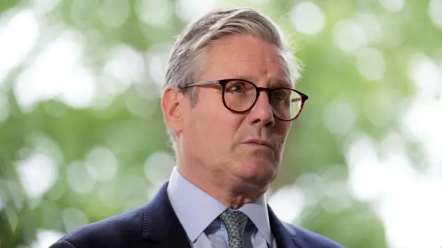 British Prime Minister Keir Starmer looks on as he speaks to the media outside the Arden Academy in Solihull, West Midlands, Britain August 8, 2024