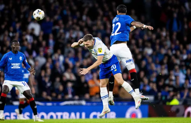 Rangers' Jefte challenges Dynamo's Oleksandr Karavaiev and receives a second yellow card