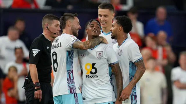 Burnley players celebrate after scoring against Luton Town