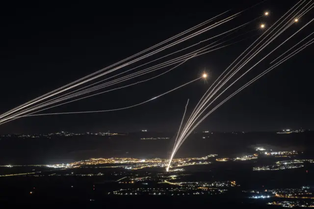 Rockets fired from southern Lebanon are intercepted by Israeli Iron Dome air defence system over the Upper Galilee region in northern Israel, on August 03, 2024.