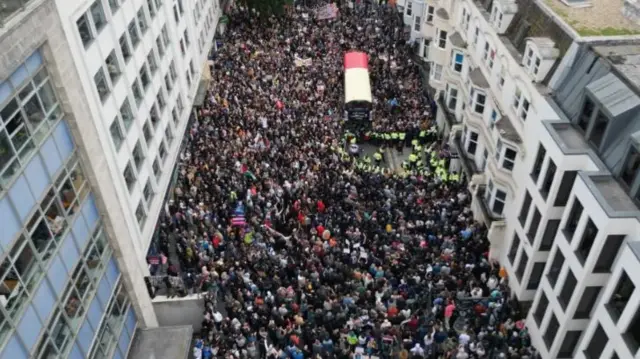 A Brighton street filled with protesters as seen from above