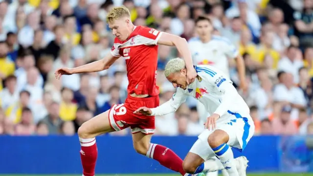 Middlesbrough and Leeds players challenge for the ball