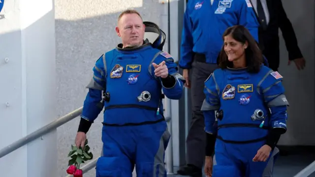 NASA astronauts Butch Wilmore and Suni Williams walk at NASA’s Kennedy Space Center, ahead of Boeing's Starliner-1 Crew Flight Test (CFT) mission on a United Launch Alliance Atlas V rocket to the International Space Station, in Cape Canaveral, Florida, U.S. May 6, 2024.