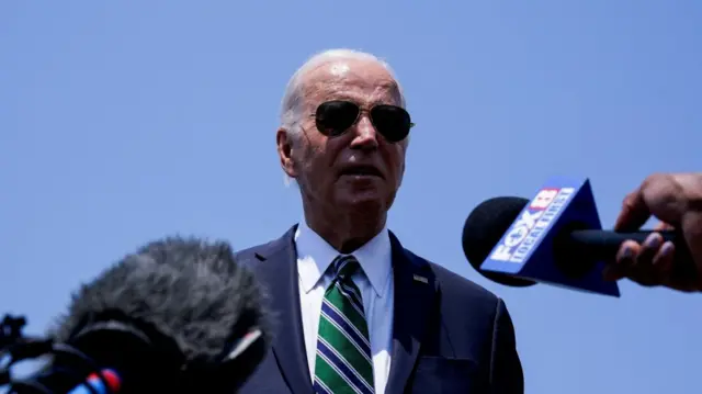 U.S. President Joe Biden speaks to the press as he arrives at Louis Armstrong New Orleans International Airport