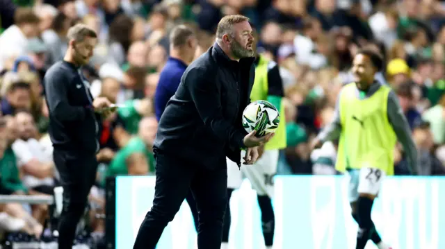 Wayne Rooney holds the ball on the touchline