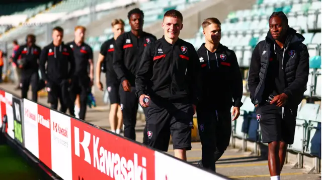 Cheltenham players arrive