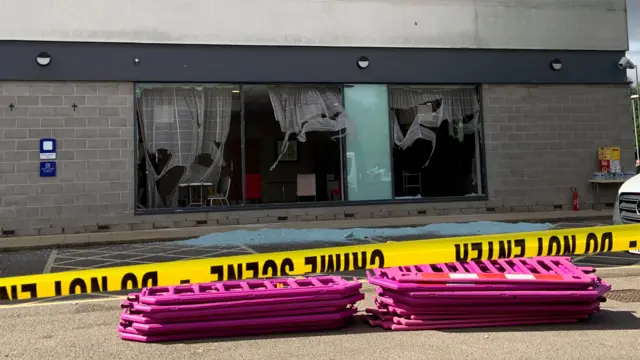 Cleaning up after the Holiday Inn at Manvers was attacked during a riot